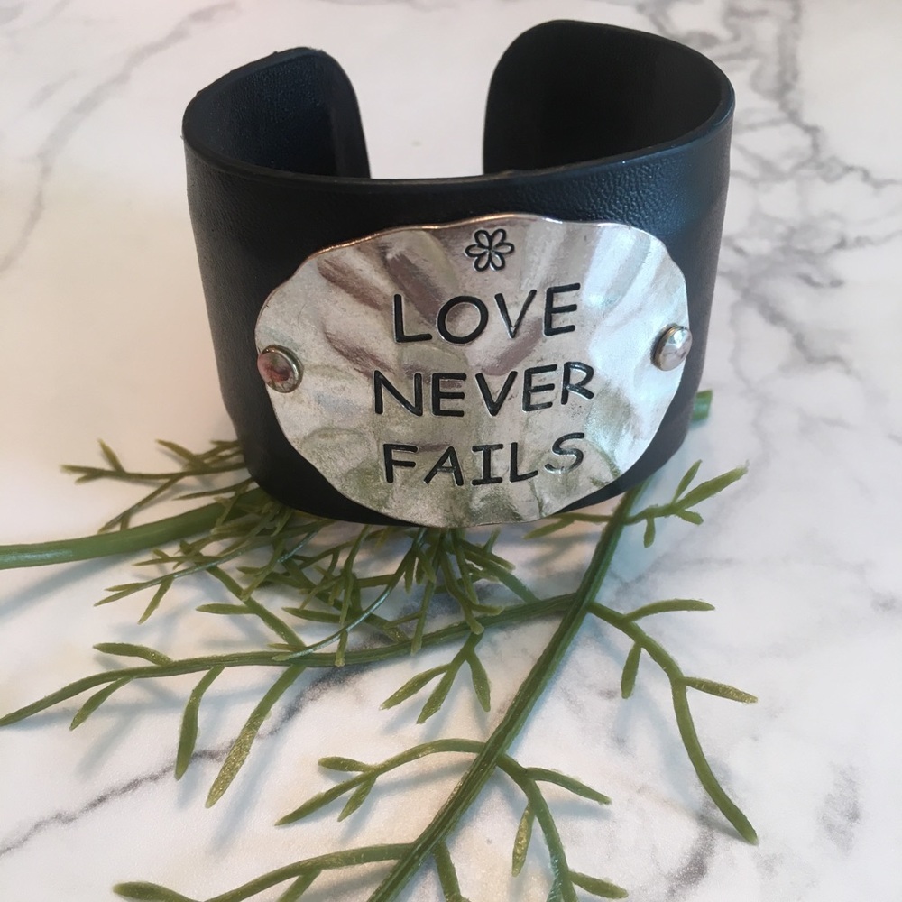 Boutique • Love never fails black leather cuff